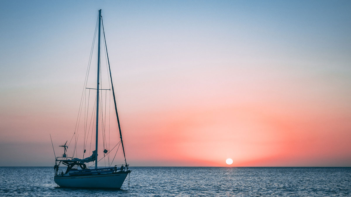 yacht-on-water-sunset-1200